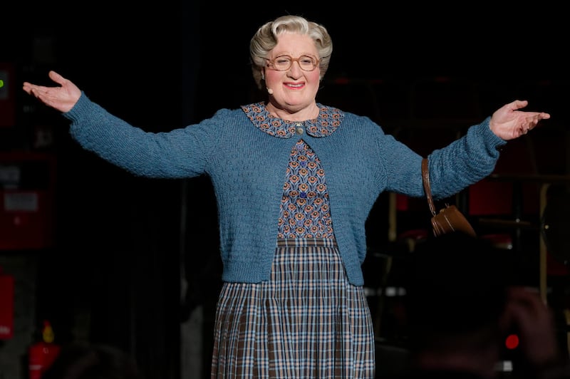 Vick Gabriel, cast member of Mrs. Doubtfire, stands on stage during a press conference.