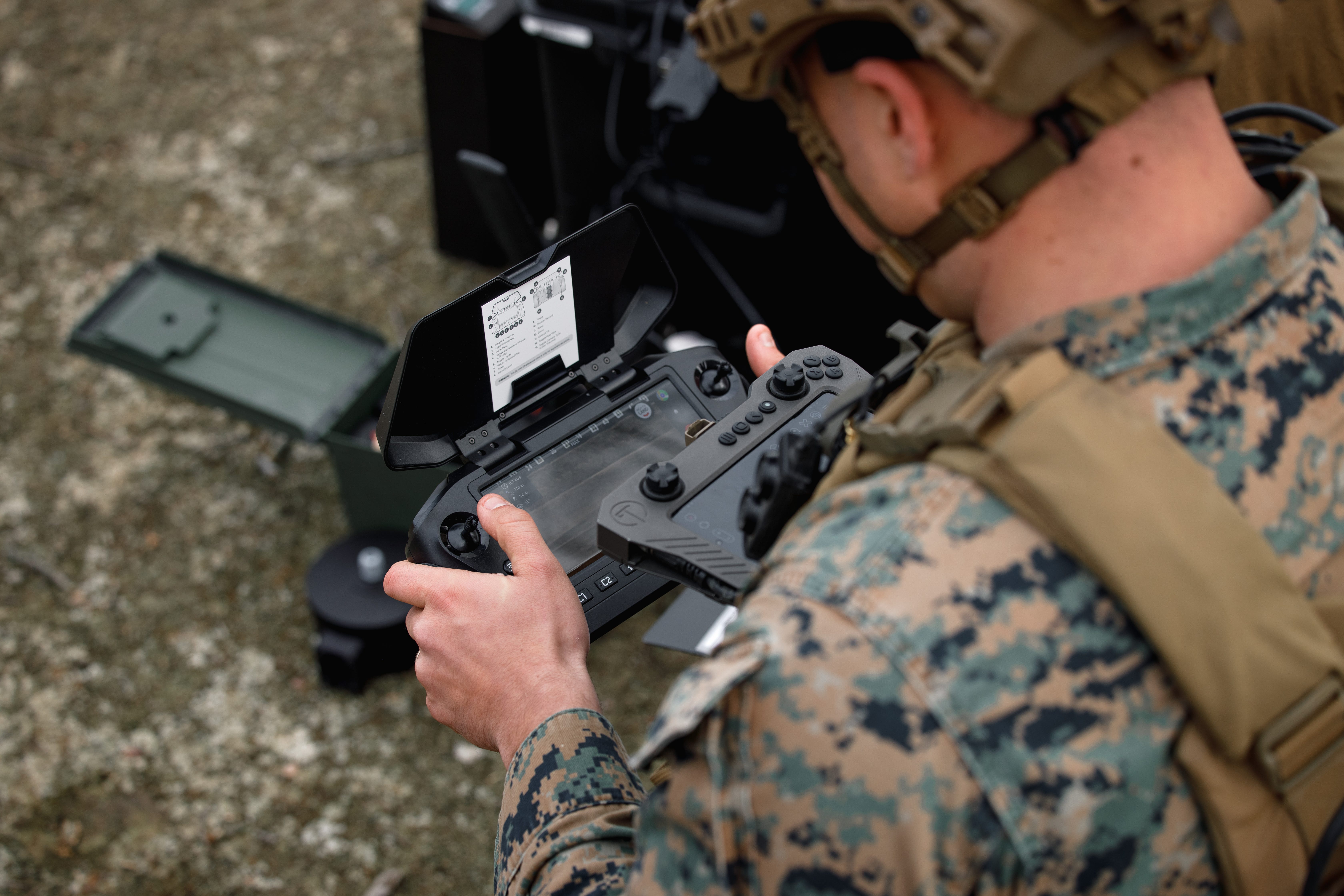 A US Marine flies a Skydio X2D drone during a demonstration range at Marine Corps Base Quantico, Virginia, March 7, 2025.