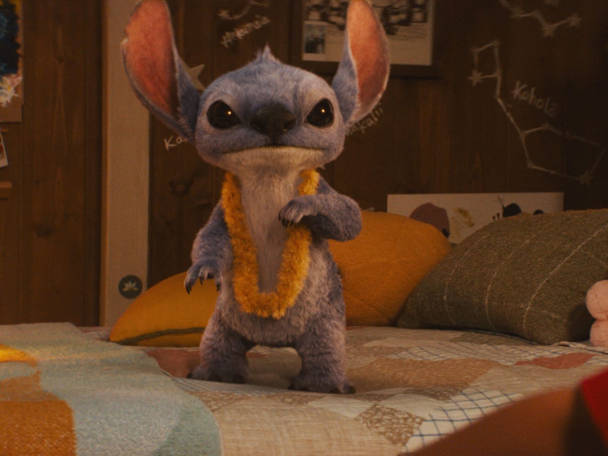 A still from "Lilo & Stitch" showing a blue alien in a bedroom.