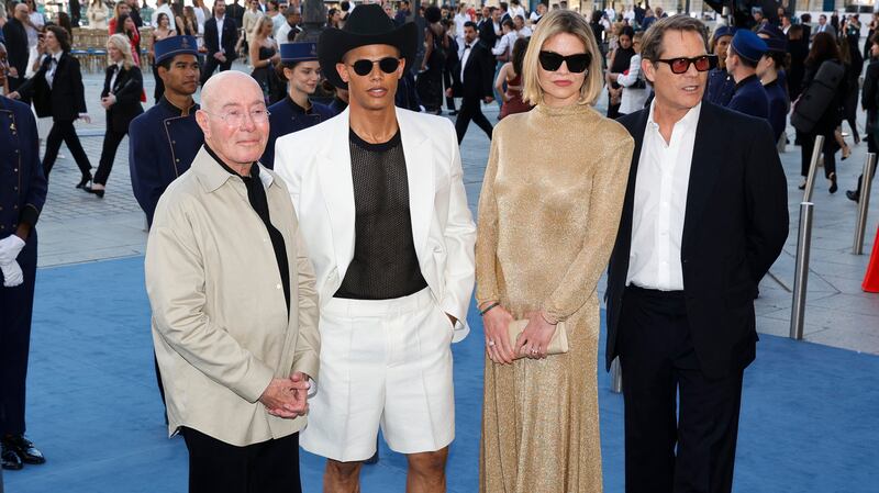 (From L) US producer David Geffen, Donovan Michaels, British model Lady Jemma Mornington and French businessman Arpad Busson poses during a photocall upon arrival to attend the Spring/Summer 2025 menswear ready to wear joint fashion show hosted by Vogue World as part of Paris Fashion Week at Place Vendome in Paris, on June 23, 2024, ahead of the upcoming Paris 2024 Olympic Games. (Photo by Geoffroy VAN DER HASSELT / AFP) (Photo by GEOFFROY VAN DER HASSELT/AFP via Getty Images)