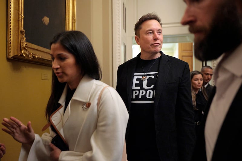 Katie Miller, pictured with Elon Musk as they departed a meeting with Senate Republicans on March 05, 2025, is said to be joining the tech billionaire "full time" as he makes his DOGE exit.