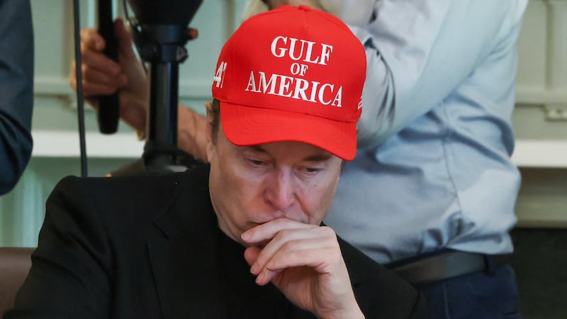 Elon Musk wears a red cap with the words "Gulf of America" as he attends a cabinet meeting at the White House.