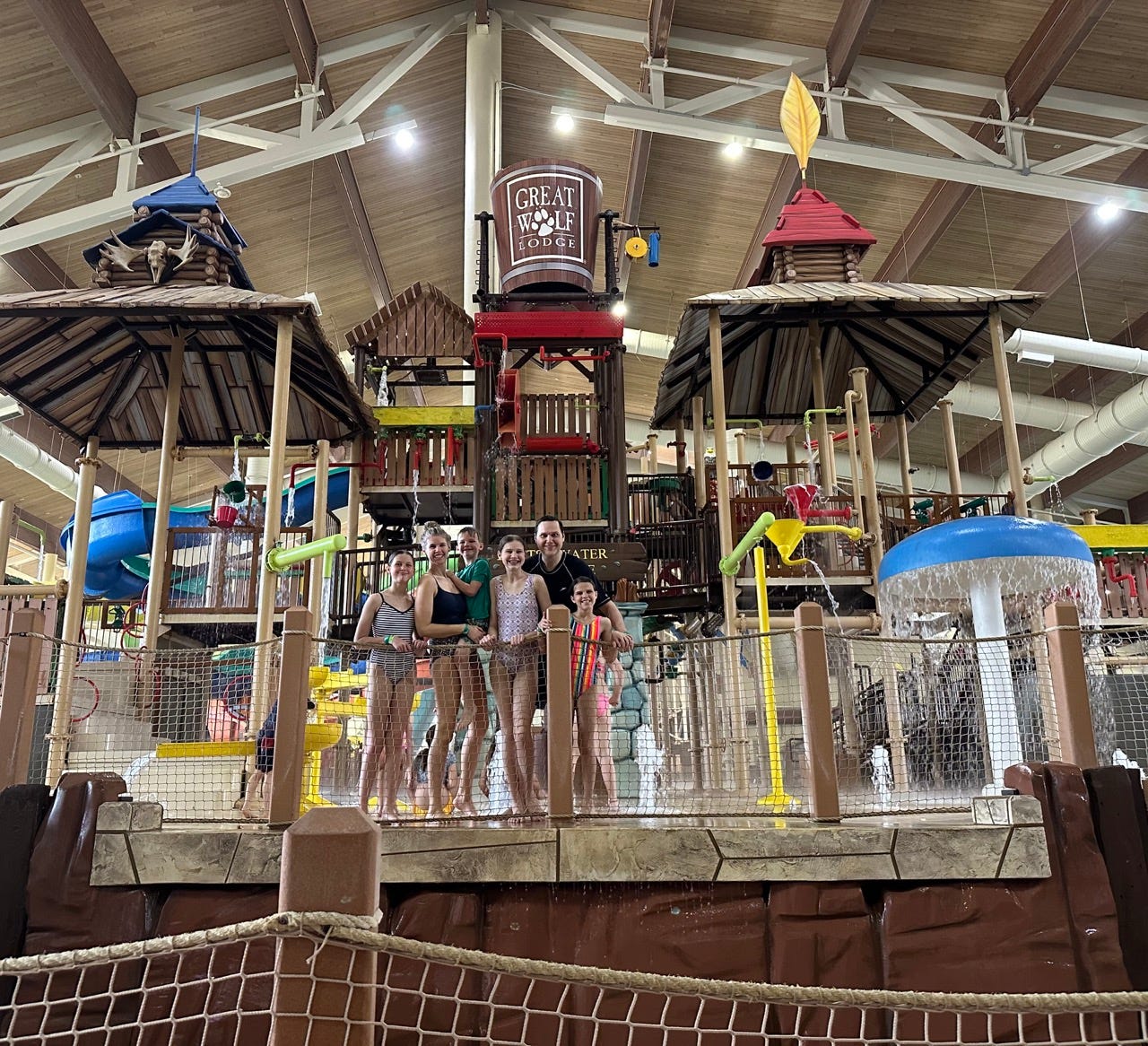 Family standing on water park structure at Great Wolf Lodge