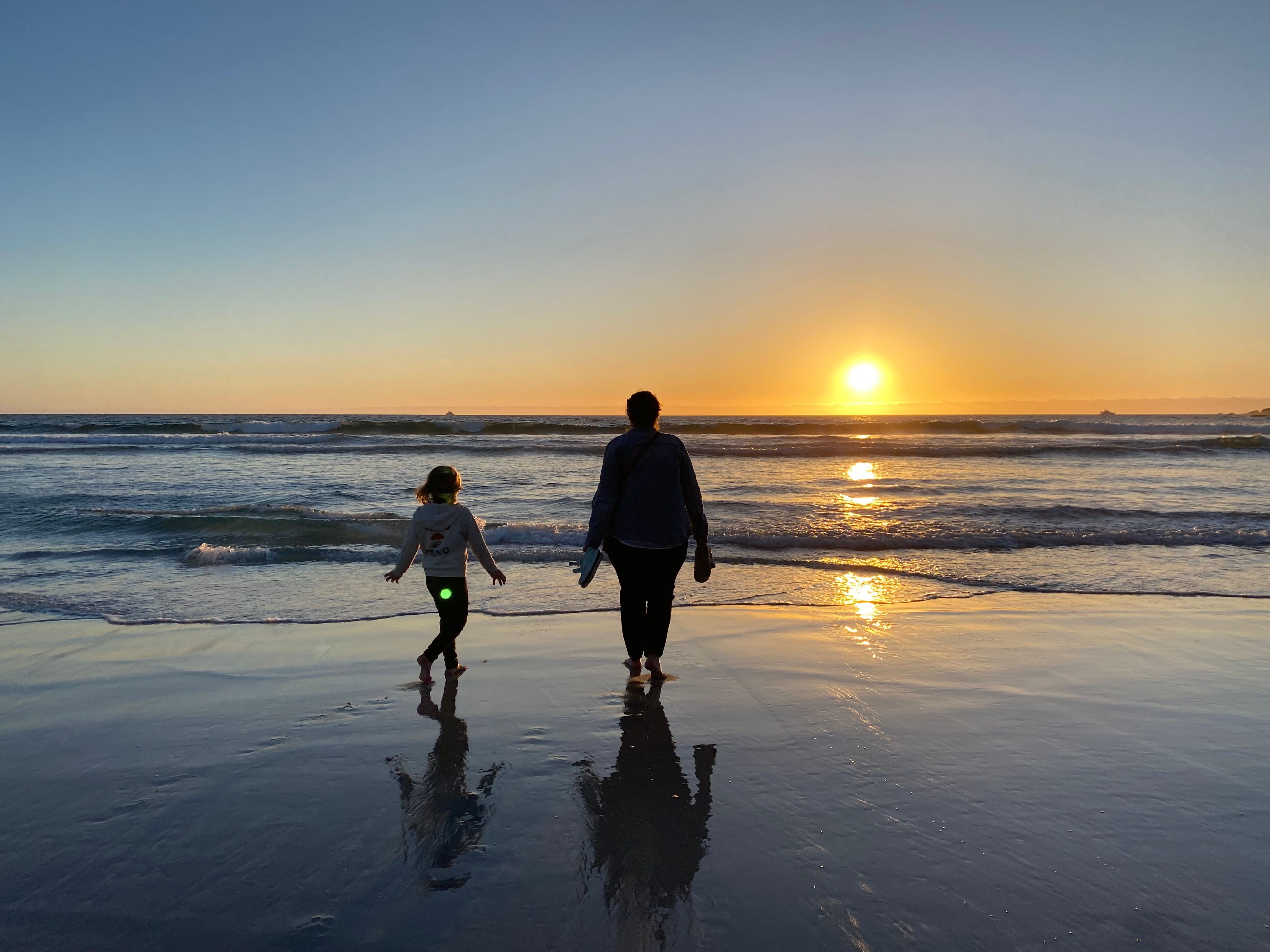 Alison Meyer with her daughter on the beach