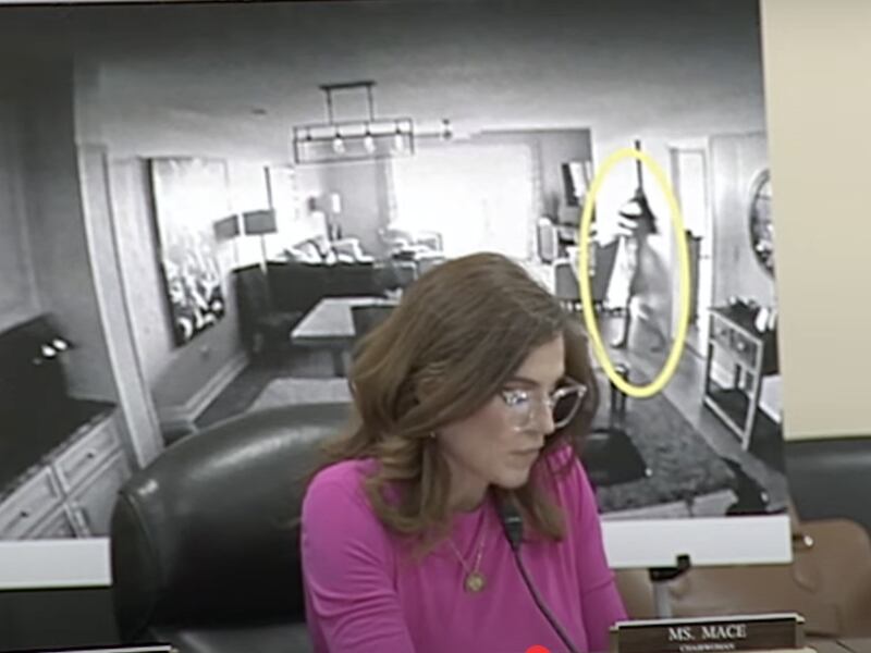 Congresswoman Nancy Mace speaking at a hearing on Capitol Hill on May 20 with a poster showing her silhouette circled as she accused her ex of filming her naked without consent.