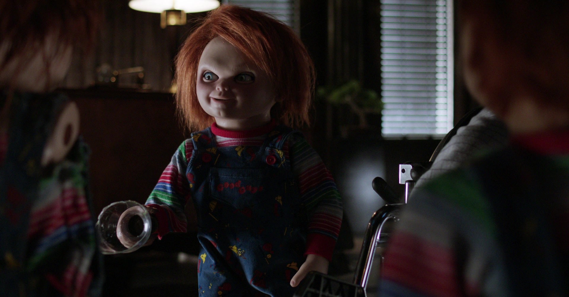 Chucky talking to two other Chucky dolls in Cult of Chucky