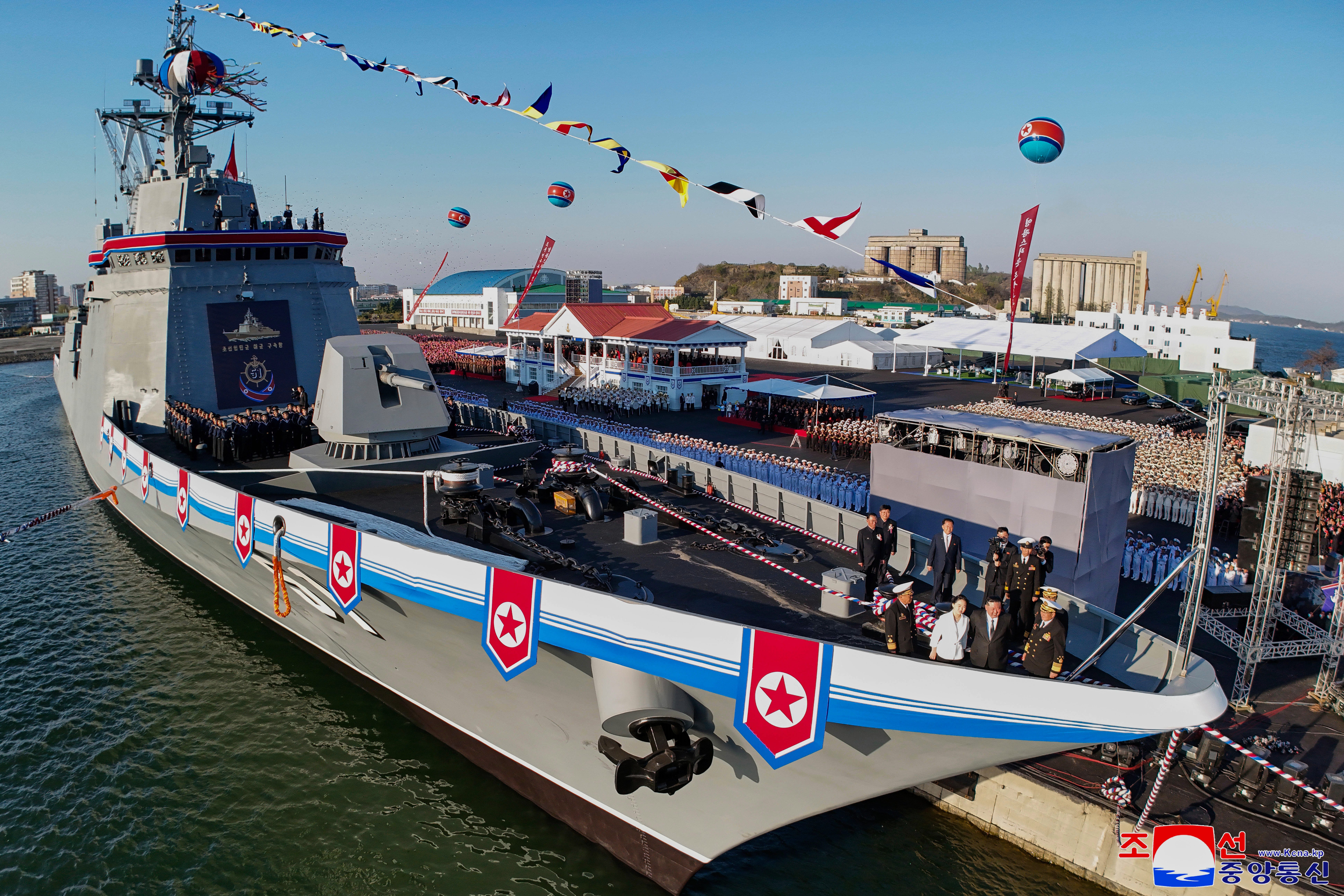North Korean leader Kim Jong Un and his daughter stand on Pyongyang's new warship during an April ceremony.
