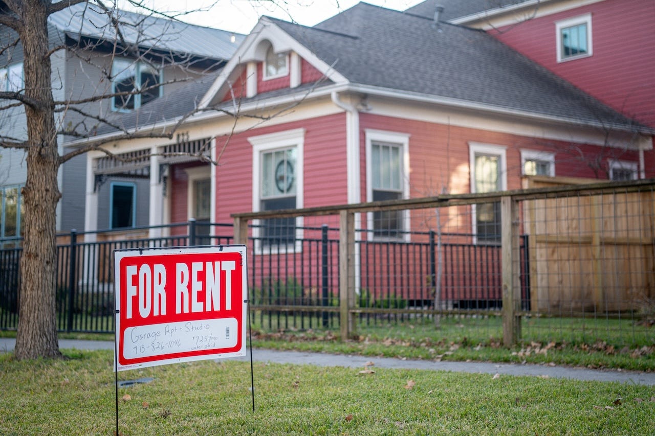 A 'For Rent' sign is posted near a home on February 07, 2022 in Houston, Texas.