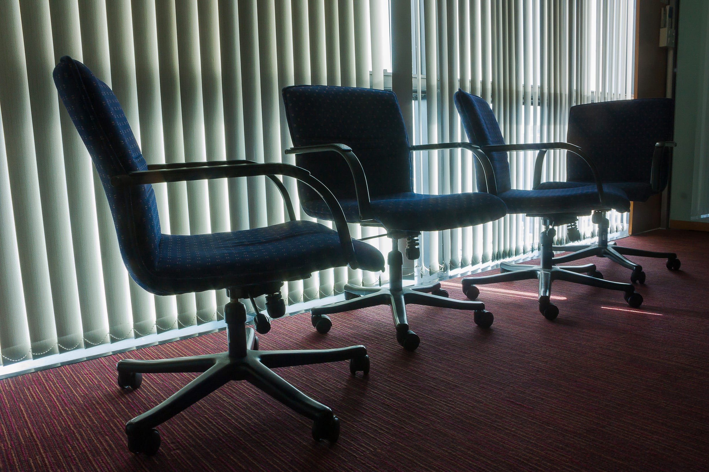 Rows of empty office chairs