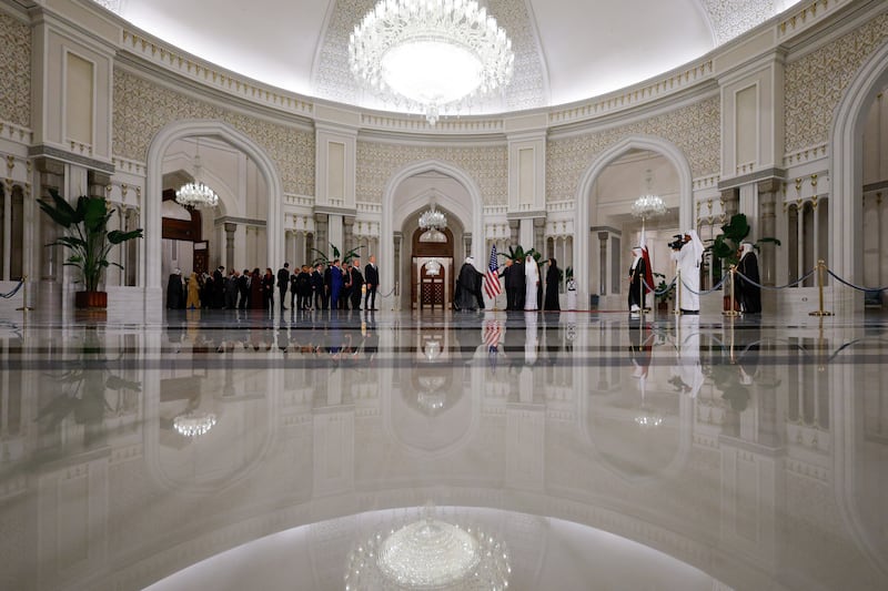 President Donald Trump and Qatar's Emir Tamim bin Hamad Al Thani welcome guests ahead of a state dinner, at Lusail Palace in Lusail, Qatar, May 14, 2025.