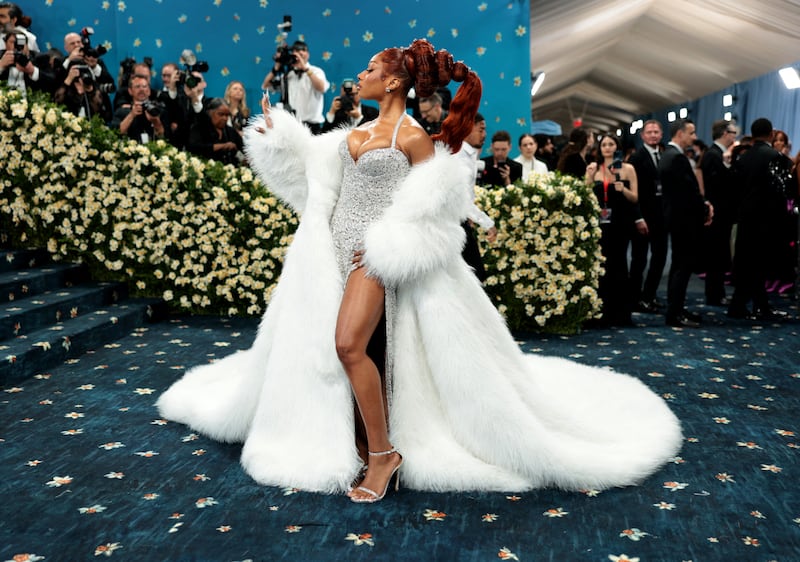 Megan Thee Stallion poses during the Met Gala, an annual fundraising gala held for the benefit of the Metropolitan Museum of Art's Costume Institute with this year's theme 'Superfine: Tailoring Black Style,' in New York City, New York, U.S., May 5, 2025.