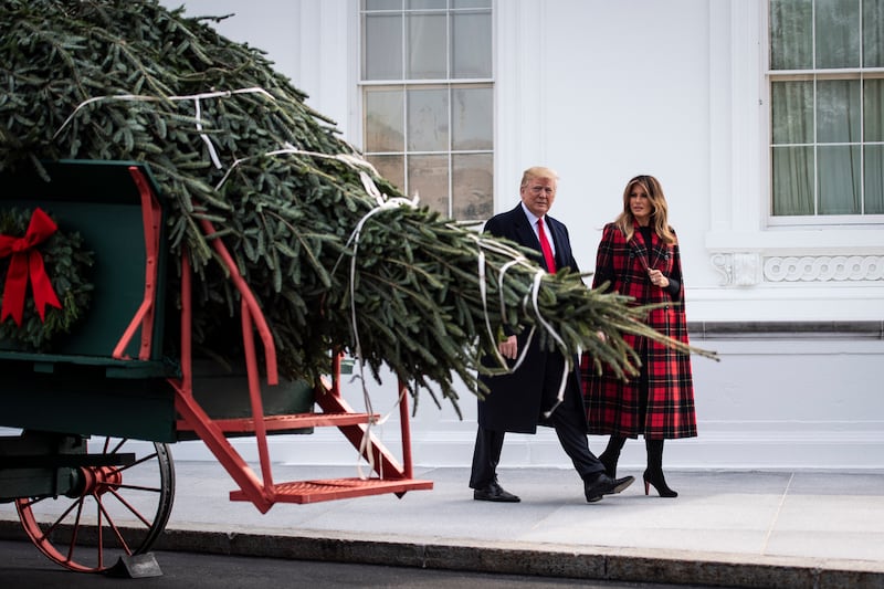 President Donald Trump and Melania Trump view the arrival of the White House Christmas tree on Monday, Nov. 19, 2018 in Washington, D.C.