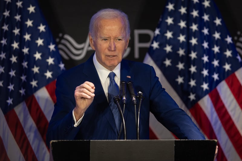 Former U.S. President Joe Biden speaks at a conference.