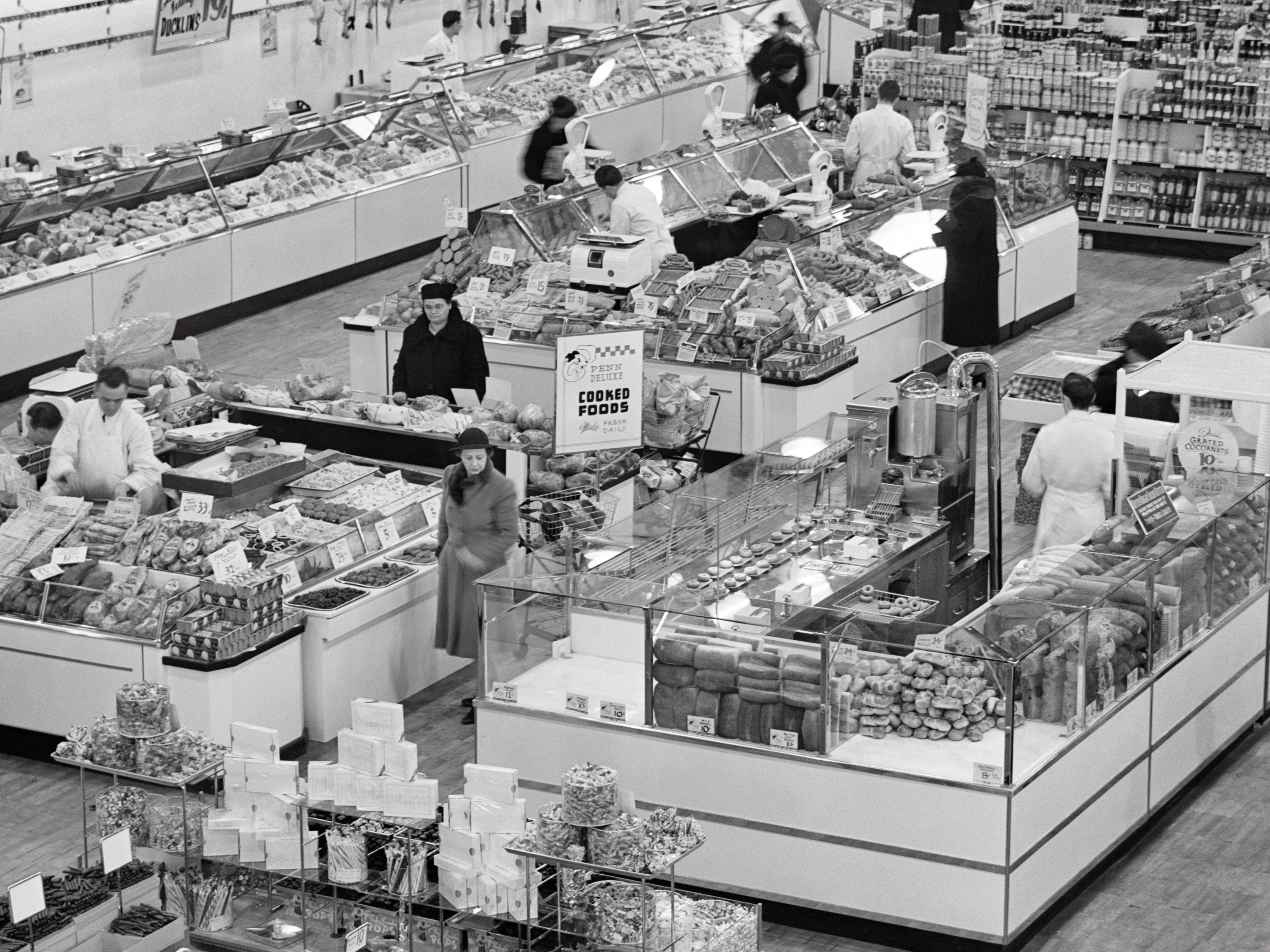 A grocery store with people shopping