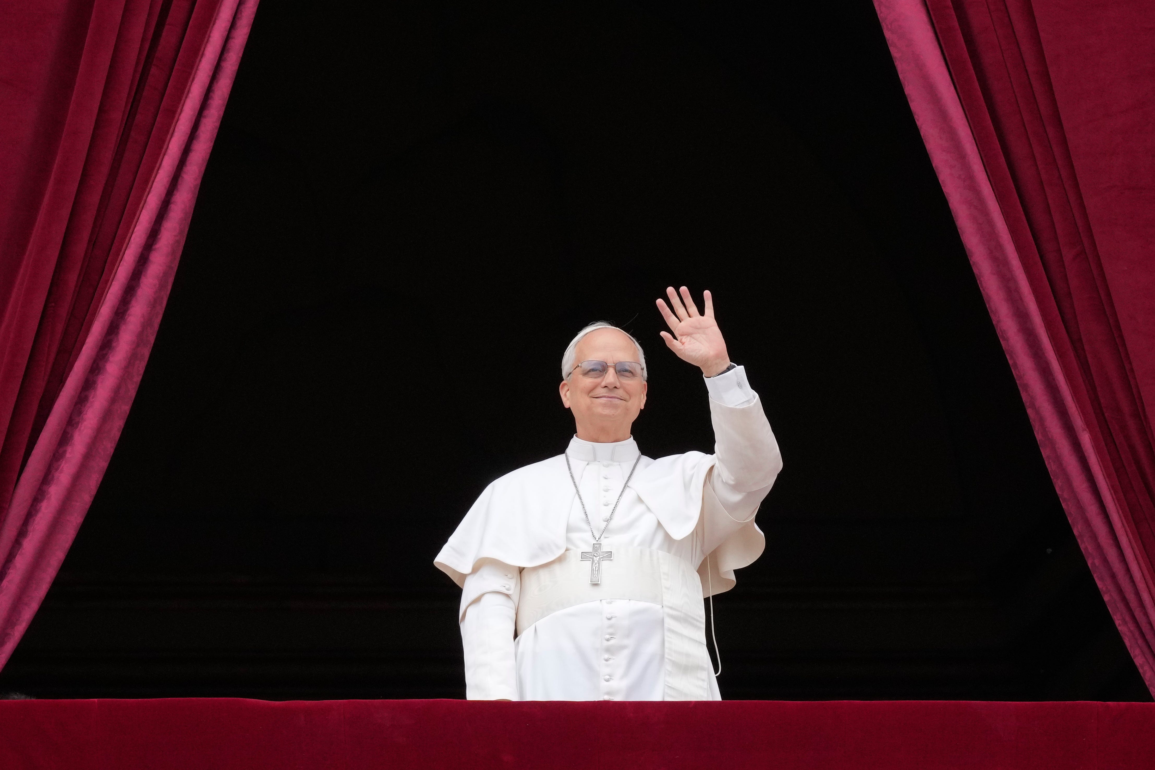 Pope Leo XIV on the central balcony of St. Peter's Basilica for his first Sunday blessing.