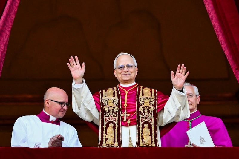Newly elected Pope Robert Francis Prevost arrives on the main central loggia balcony of the St Peter's Basilica