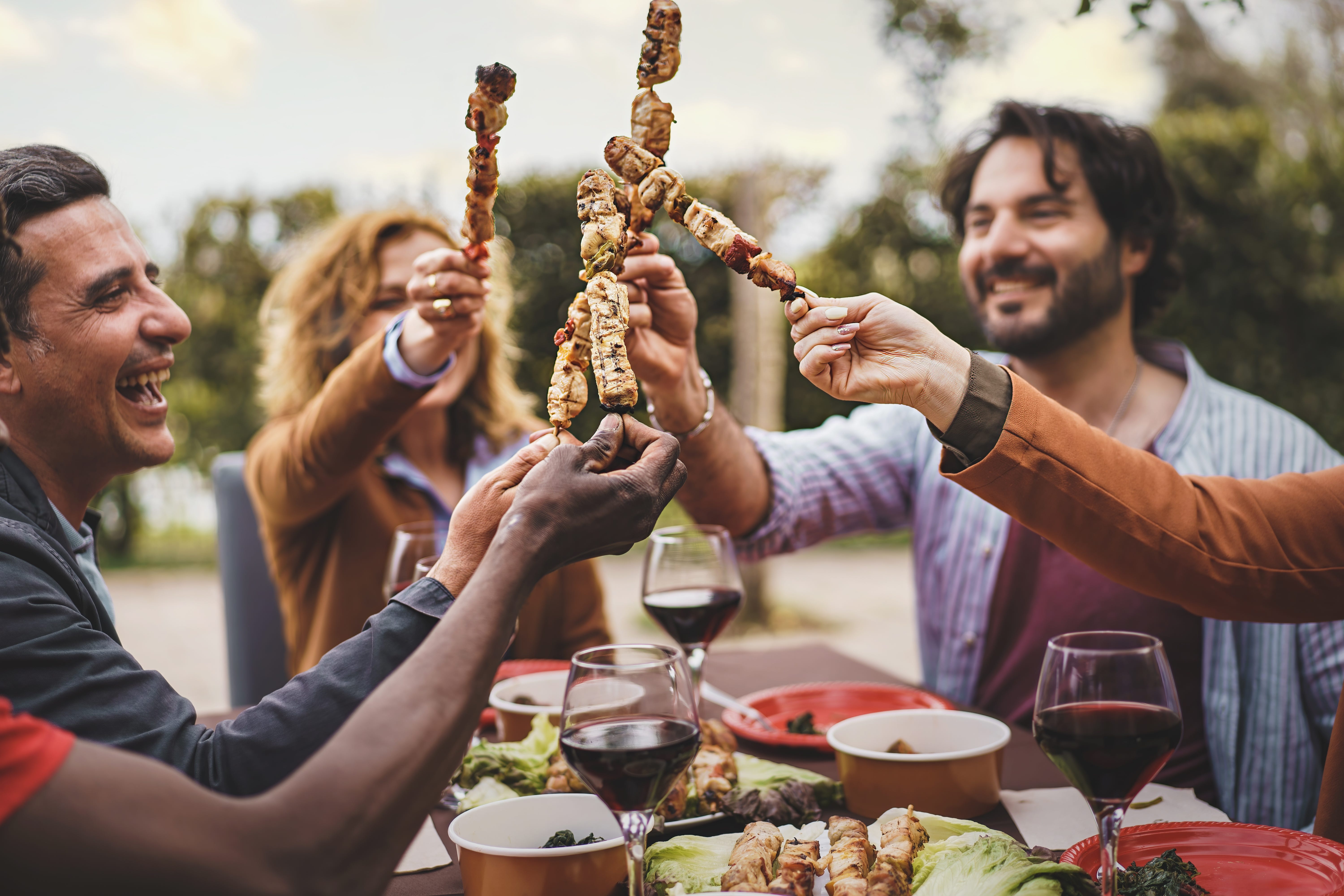 people toasting skewers