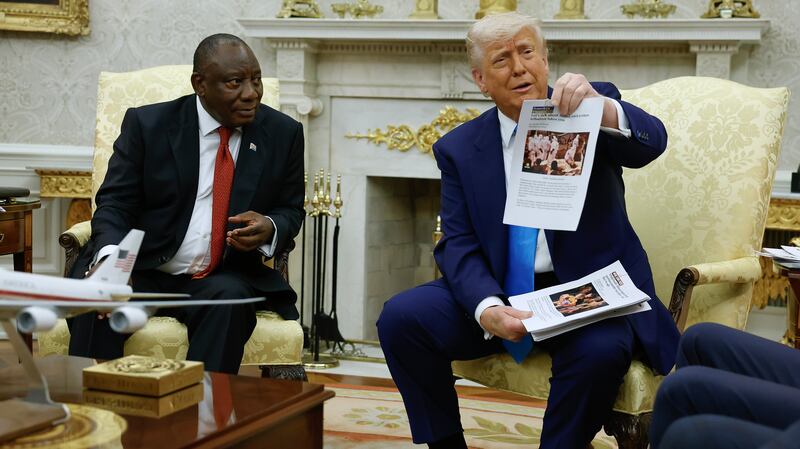 Trump confronted the South African leader with a pile of printed materials during a chaotic Oval Office meeting.