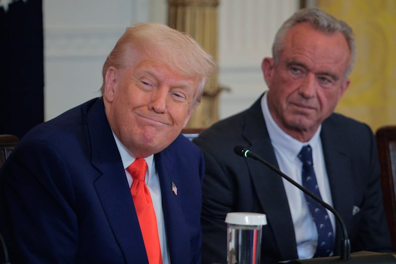WASHINGTON, DC - MAY 22: U.S. President Donald Trump and Health and Human Services Secretary Robert F. Kennedy Jr. attend an event introducing a new Make America Healthy Again Commission report in the East Room of the White House on May 22, 2025 in Washington, DC. The commission, which is tasked with studying the potential causes for the "childhood chronic disease crisis," recommends reassessing the nation’s childhood vaccine schedule, scrutinizing ultra-processed foods and studying pesticides used in commercial farming. The Trump administration has proposed a FY2026 budget of $94 billion for the Department of Health and Human Services -- a reduction of about 26-percent from the 2025 level -- cutting programs and staff at the National Institutes of Health and the Centers for Disease Control and Prevention. (Photo by Chip Somodevilla/Getty Images)