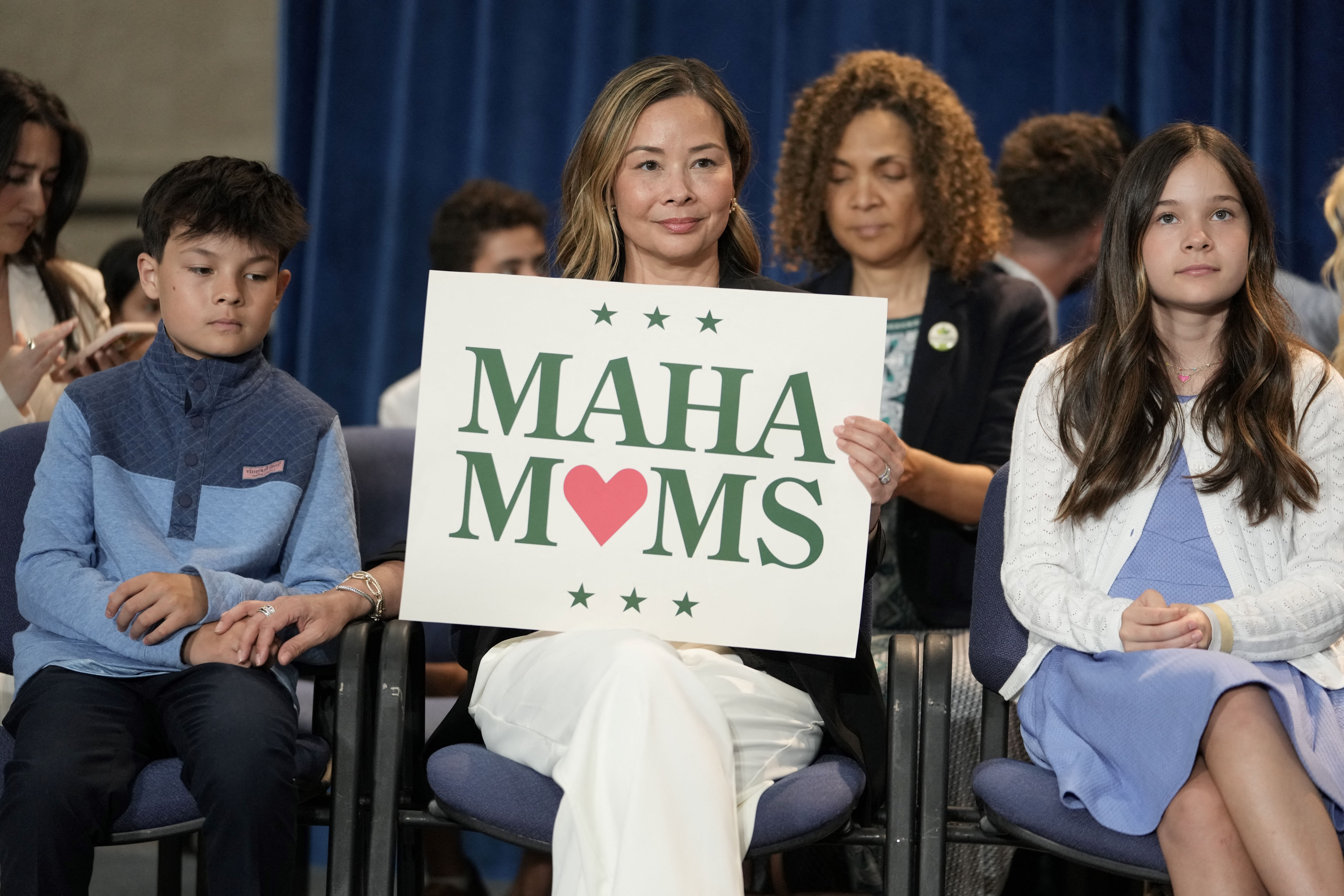 woman with maha moms sign