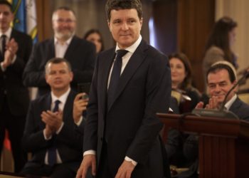 Romania’s new president is sworn in as a political crisis eases, but challenges loom