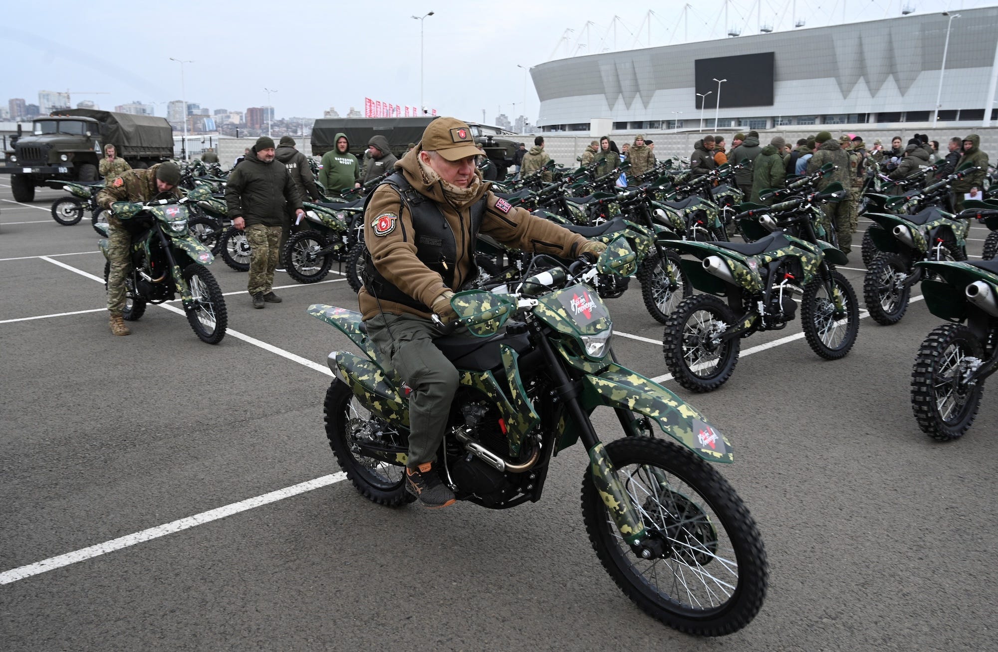 Russian troops use motorcycles to assault Ukrainian positions while trying to evade the drones that stalk them. Russia's military received new motocross bikes at a ceremony in November.