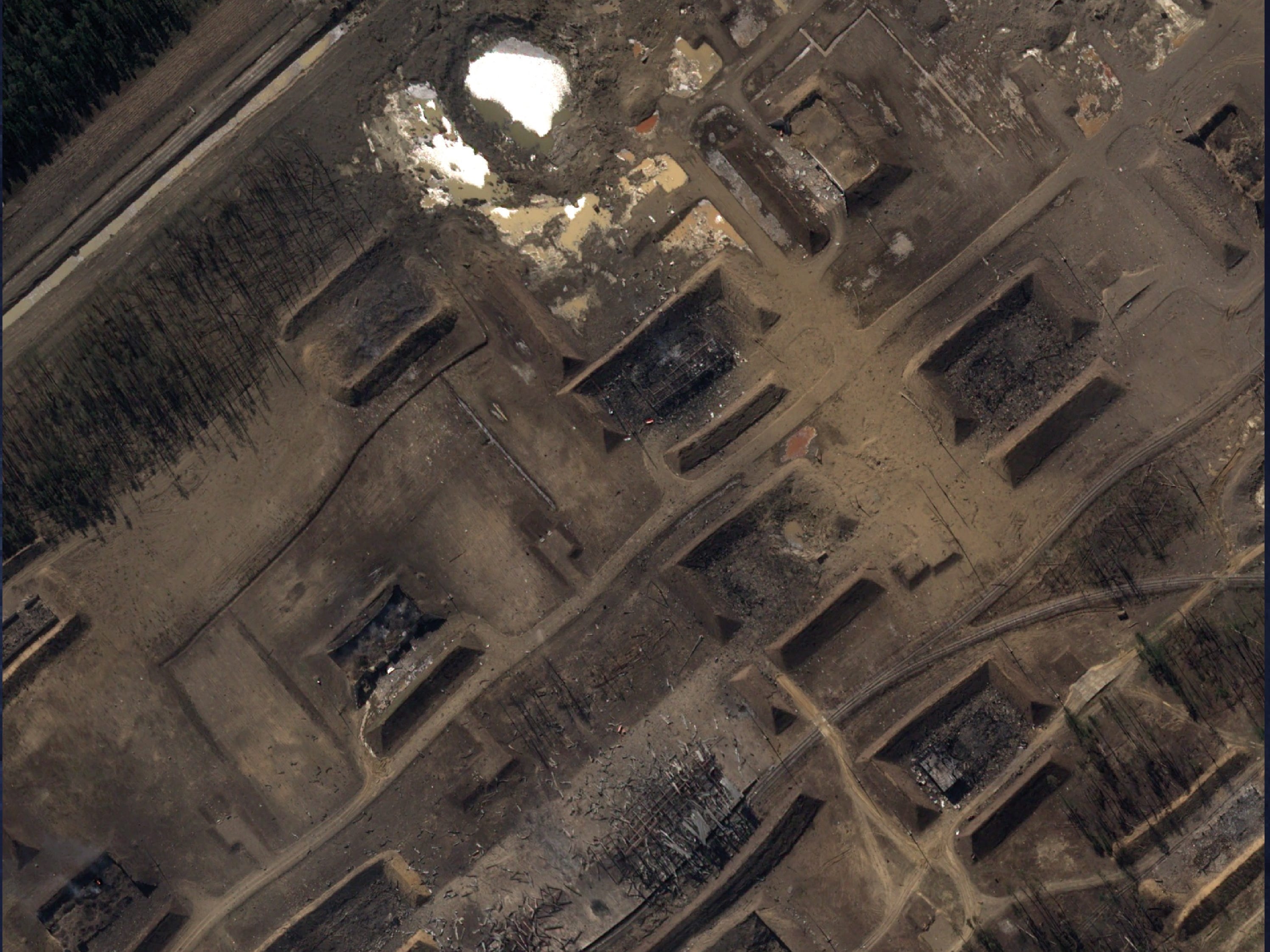 A satellite image over the 51st GRAU arsenal shows ruined buildings and craters left by the explosions at the 51st GRAU arsenal.