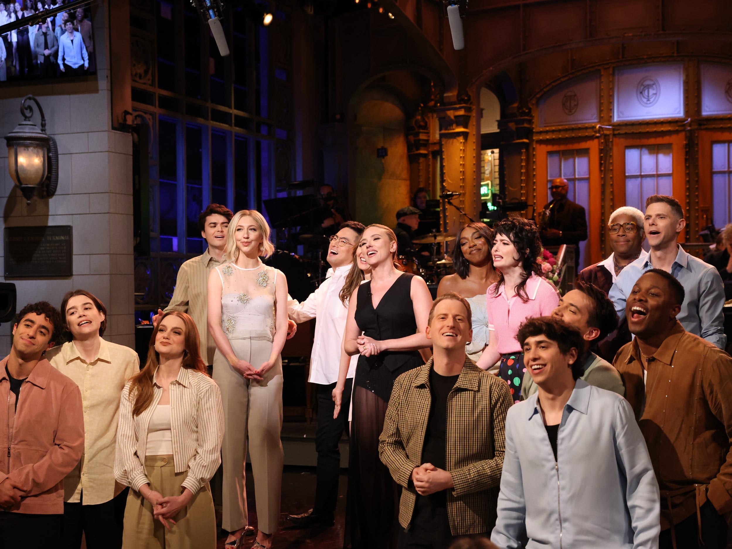 The cast of "SNL" gather around Scarlett Johansson during her monologue in the 50th season finale.