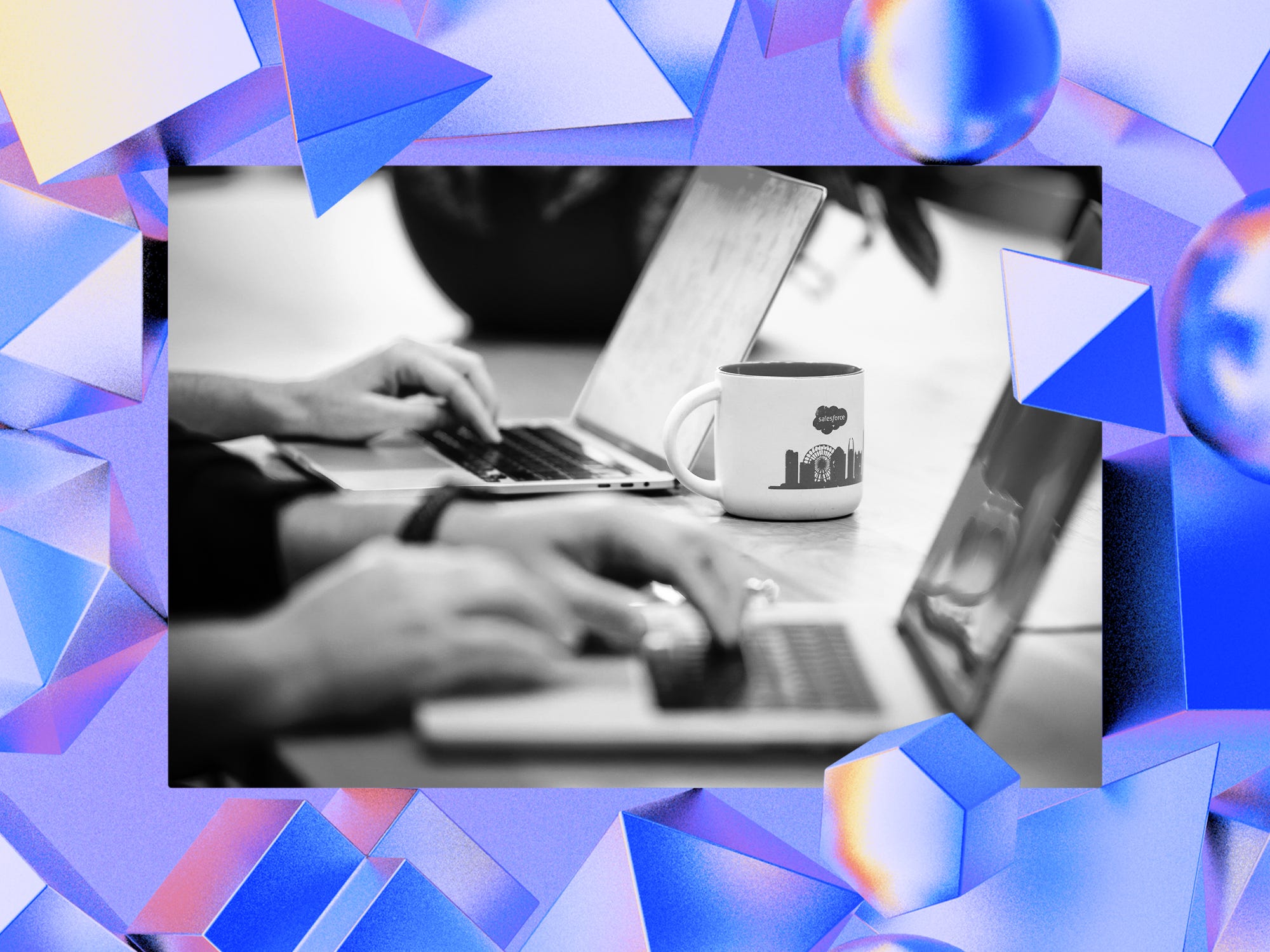 Close-up photo of hands typing on laptops, with the camera focused on a mug featuring the Salesforce logo, on an abstract AI-themed Background.