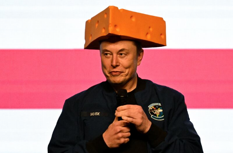 Elon Musk wears a cheese hat as he holds a rally in support of a Wisconsin state Supreme Court candidate in April.