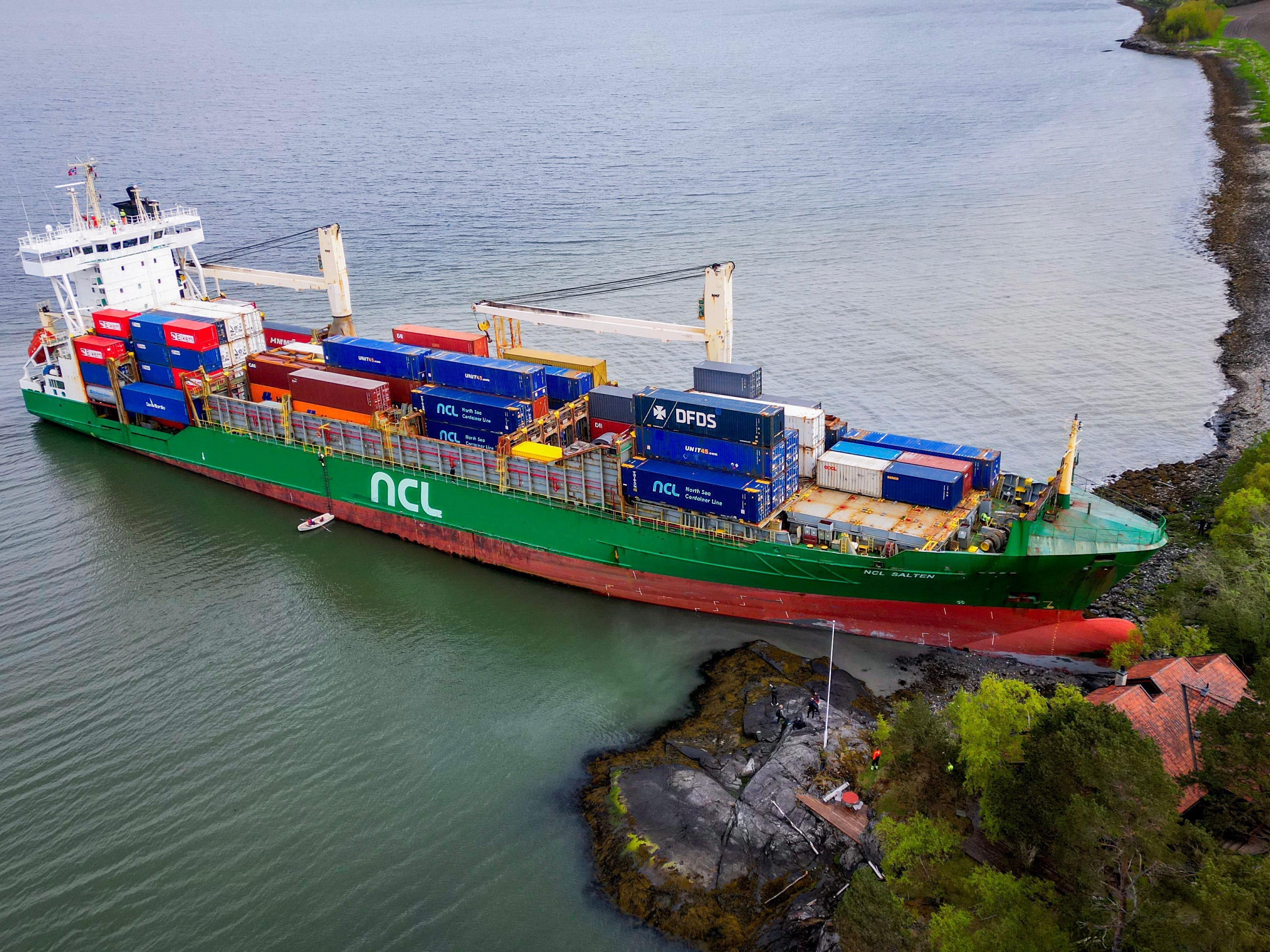 An aerial view of a container ship running aground in Trondheim, Norway.