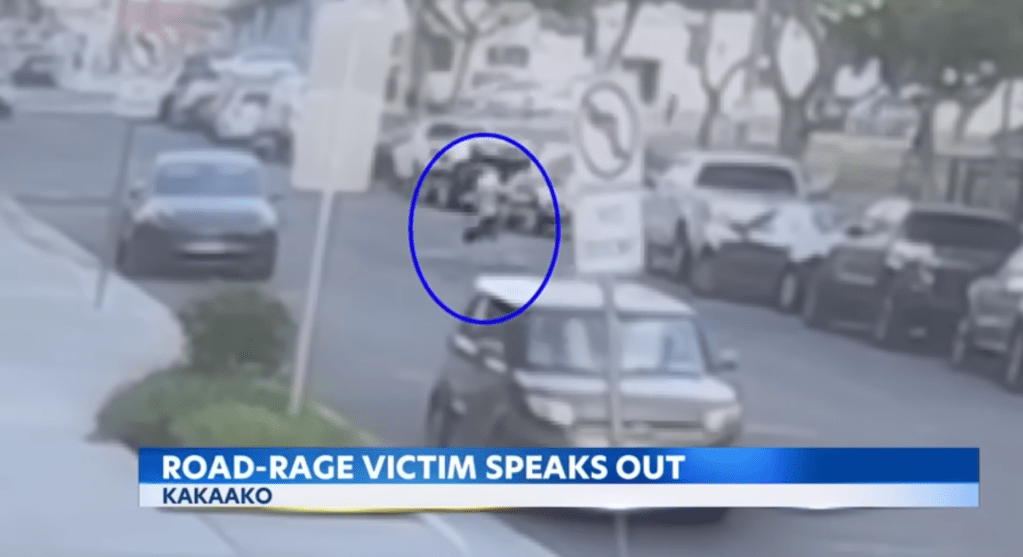 Nathaniel Radimak walks back to his car after allegedly attacking an 18-year-old driver on the roads of Honolulu, Hawaii on May 7, 2025.
