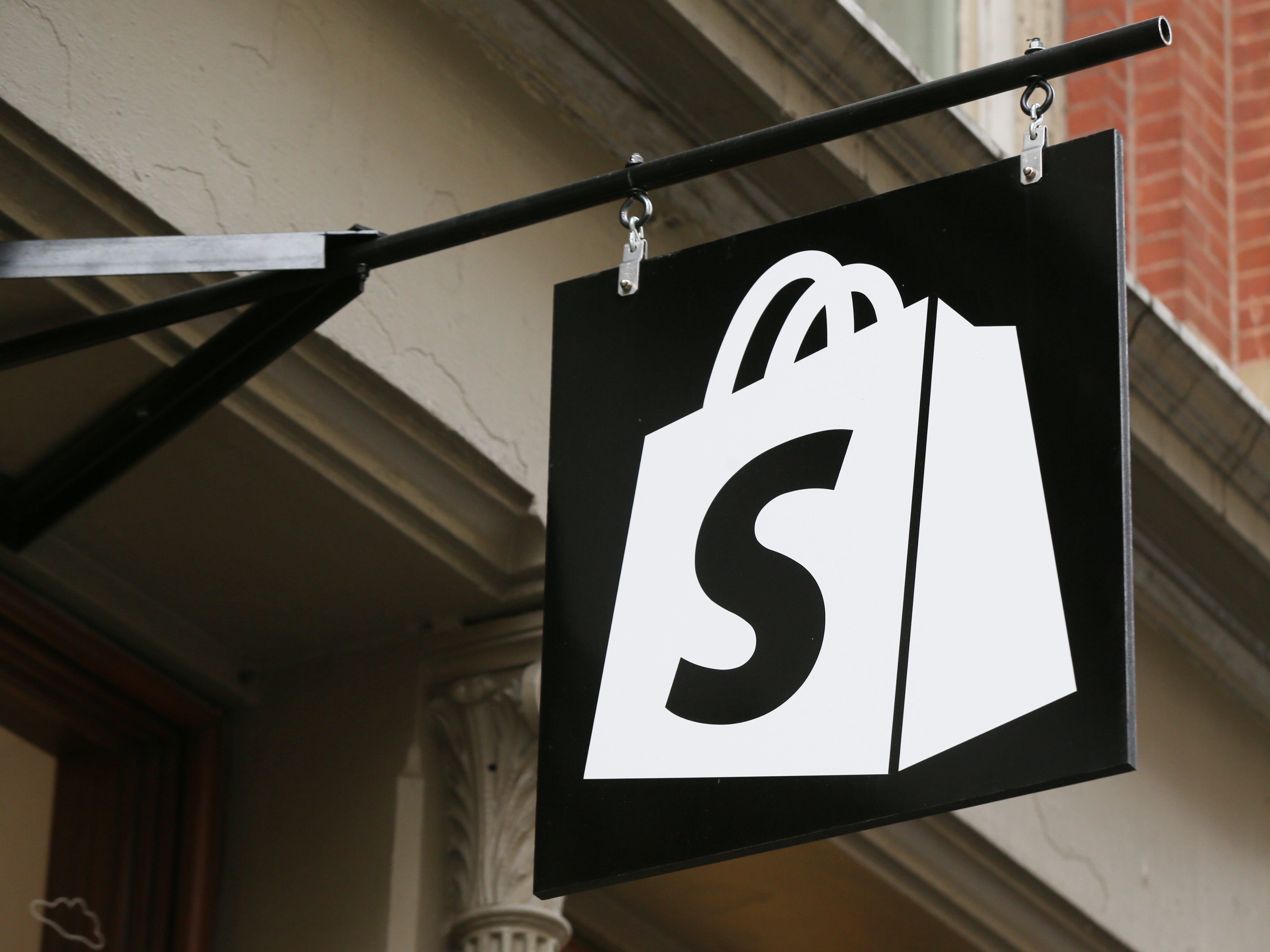 Shopify logo on a sign.