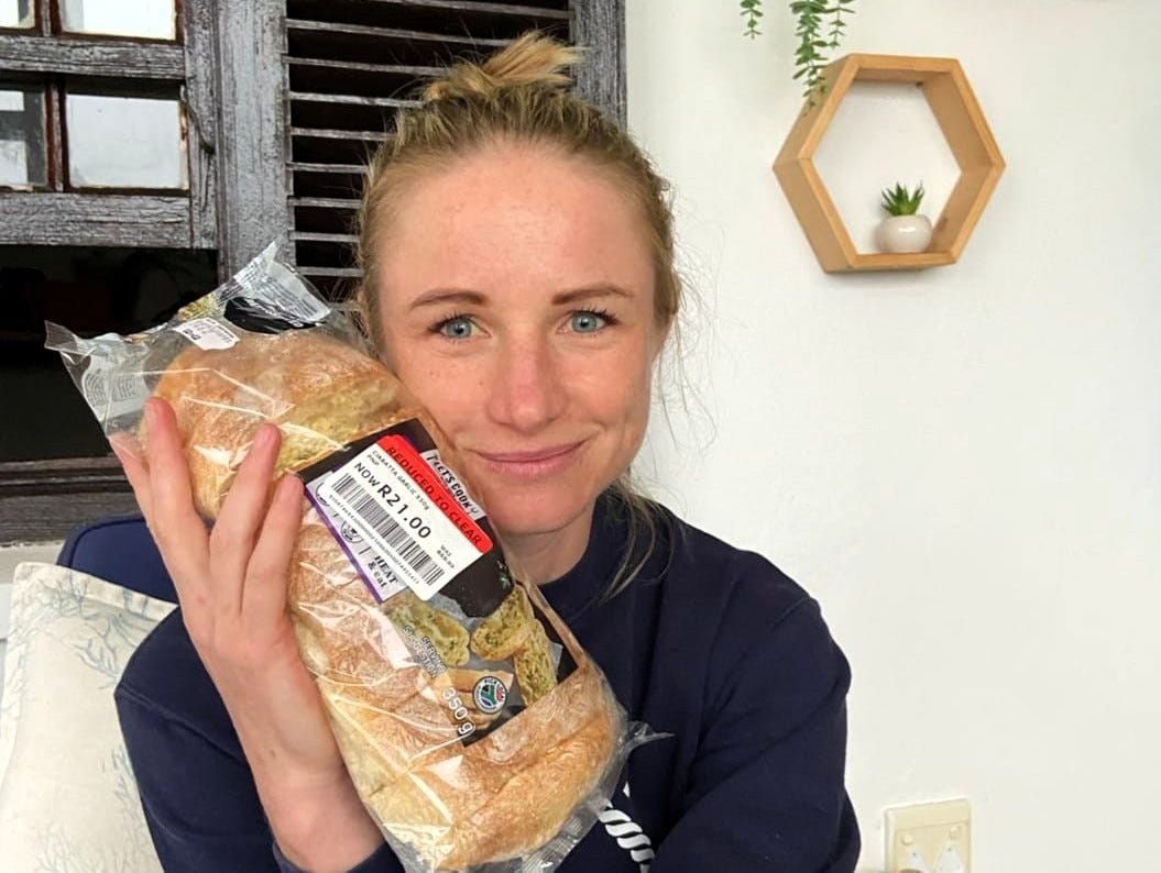 Shea Karssing holding a marked down bag of garlic bread