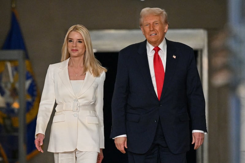 President Donald Trump and Attorney General Pam Bondi arrive to speak at the Department of Justice in Washington, DC, on March 14, 2025. (Photo by ROBERTO SCHMIDT / AFP) (Photo by ROBERTO SCHMIDT/AFP via Getty Images)