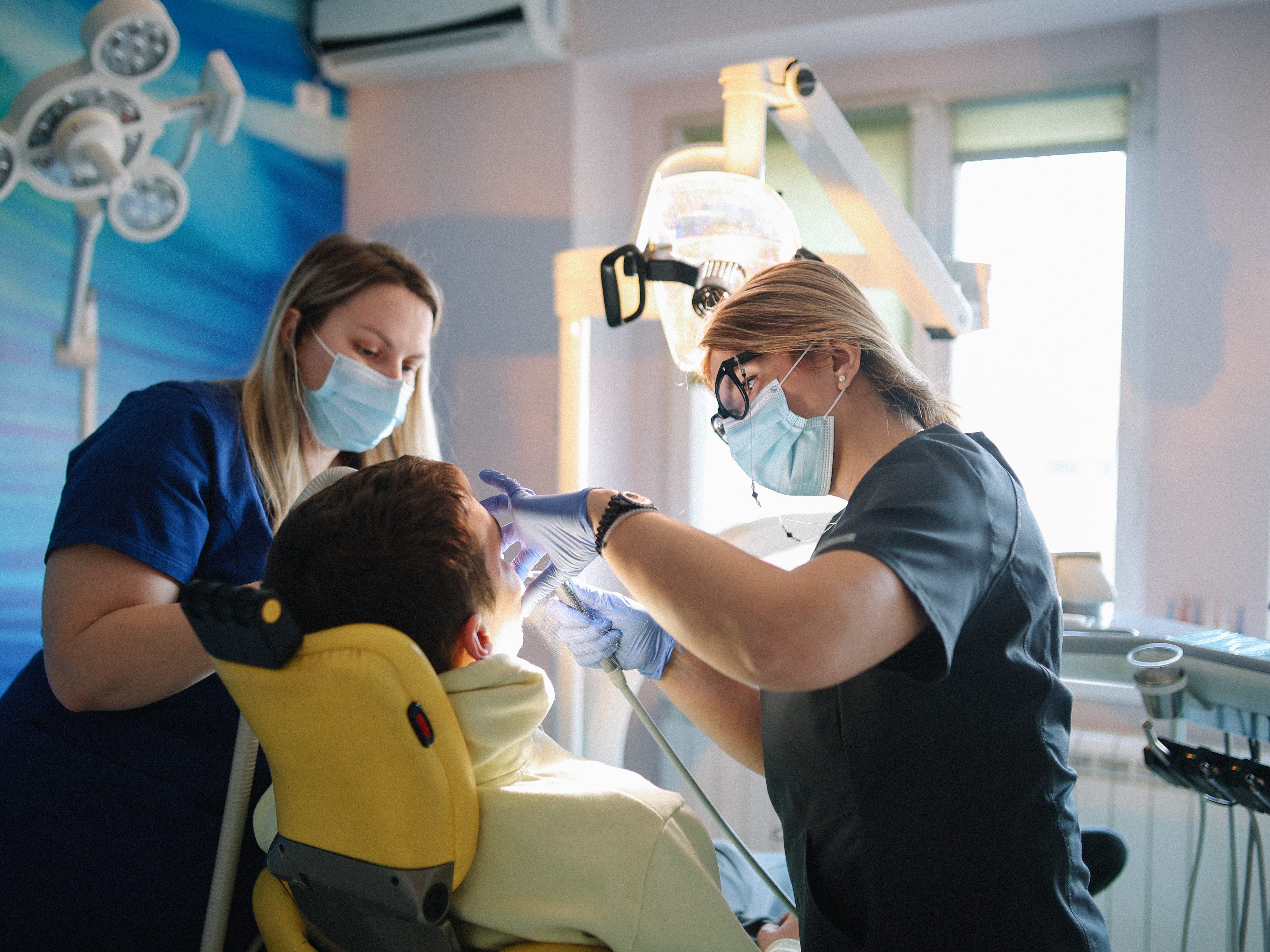 Dentists with a patient