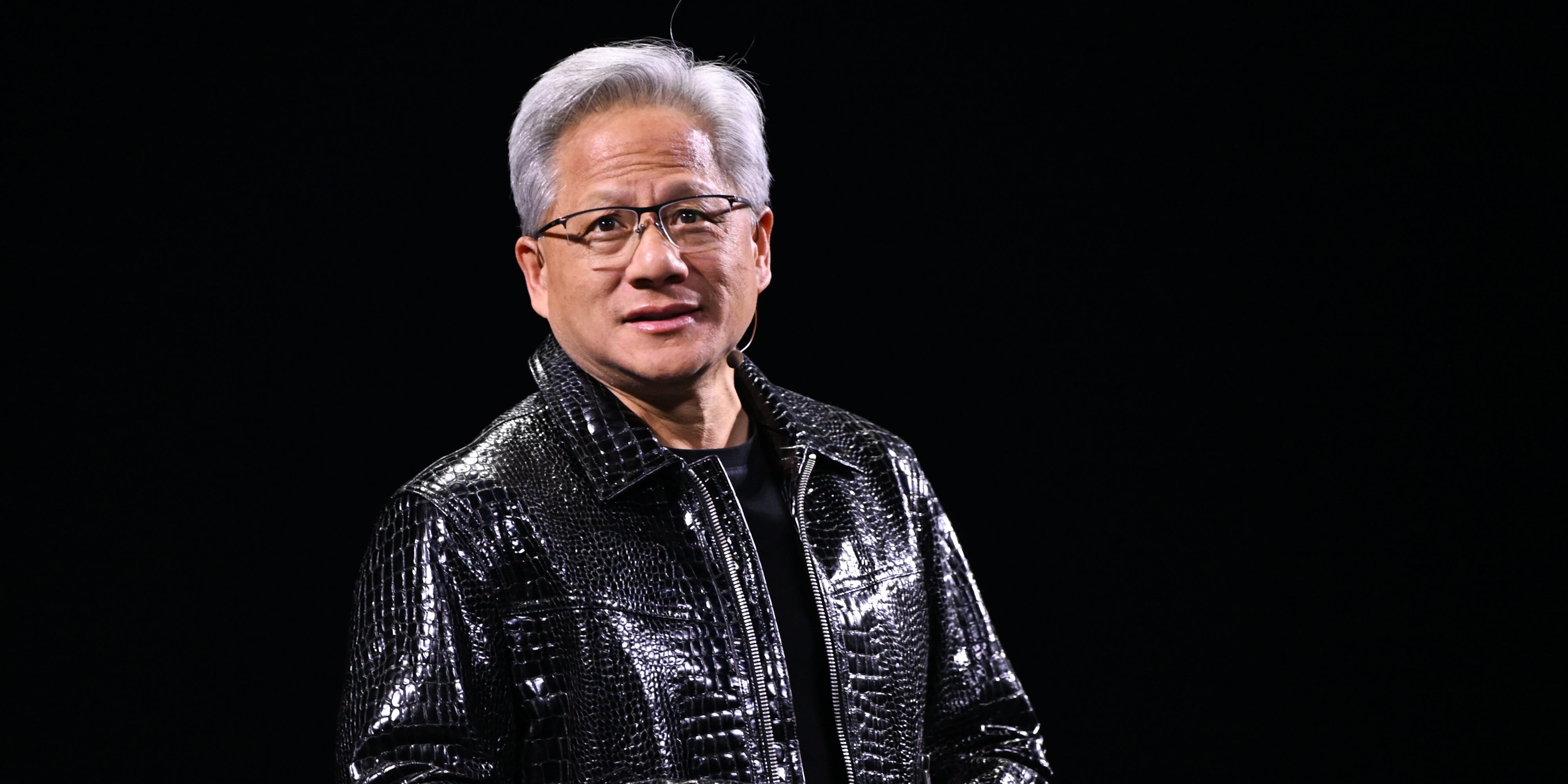 Jensen Huang standing in leather jacket