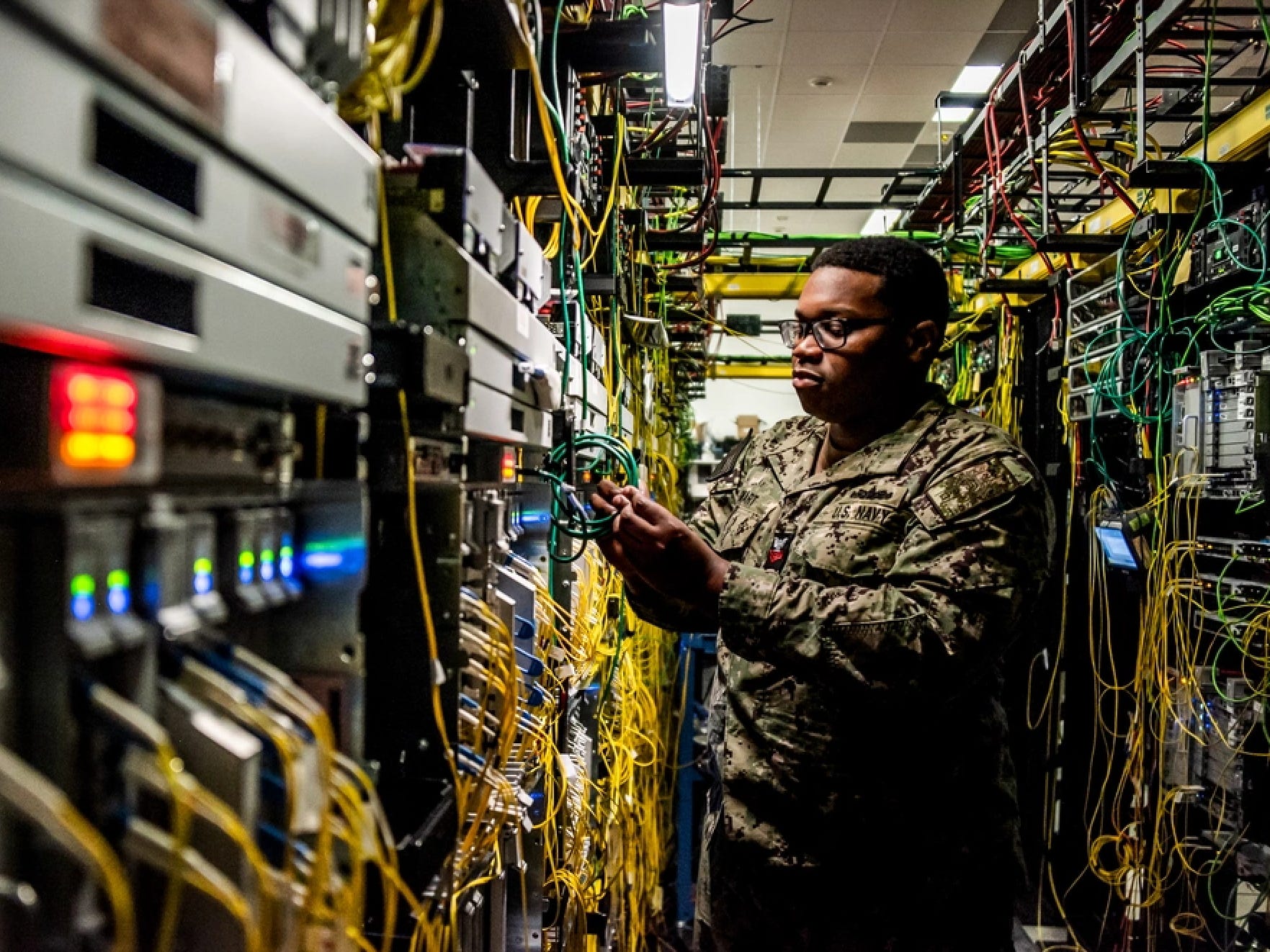 Warfighters operate equipment at the Defense Information Systems Agency Headquarters at Fort Meade, Maryland.