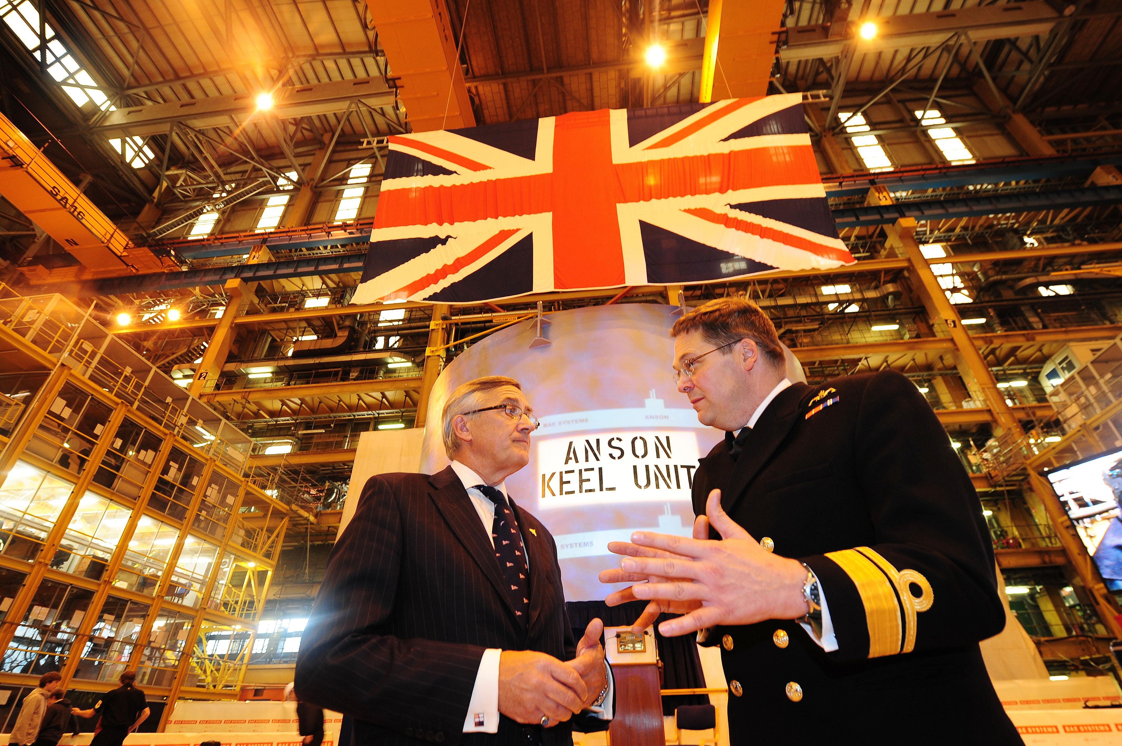 Minister for International Security Strategy Gerald Howarth (left) and Rear Admiral Simon Lister, the Ministry of Defence's director general of submarines at a ceremony to mark the start of the main construction phase of HMS Anson at the BAE Systems Submarine Solutions shipyard in Barrow-In -Furness, Cumbria.