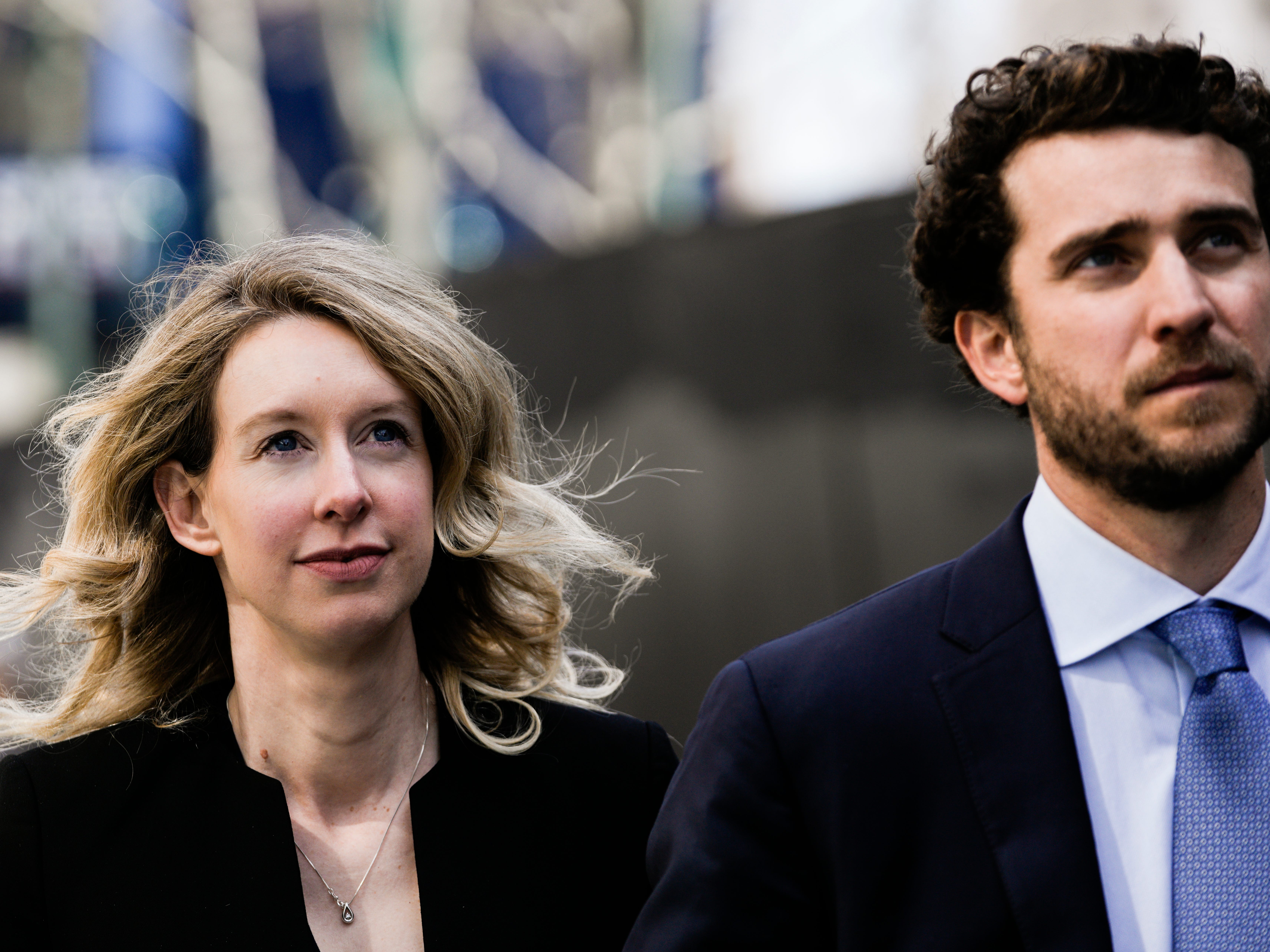 Former Theranos CEO Elizabeth Holmes alongside her boyfriend Billy Evans, walks back to her hotel following a hearing at the Robert E. Peckham U.S. Courthouse on March 17, 2023 in San Jose, California.