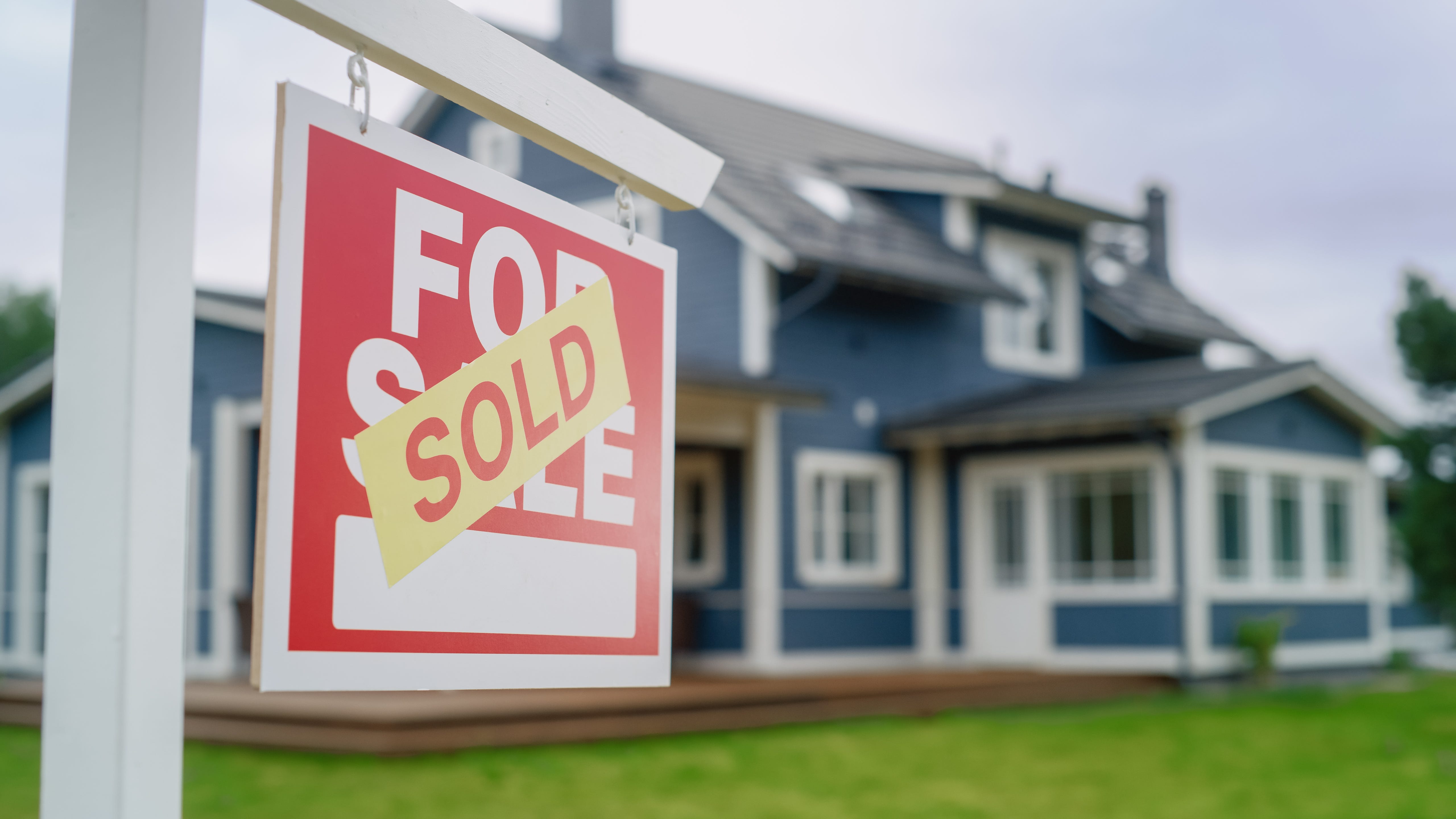 House with sold sign.