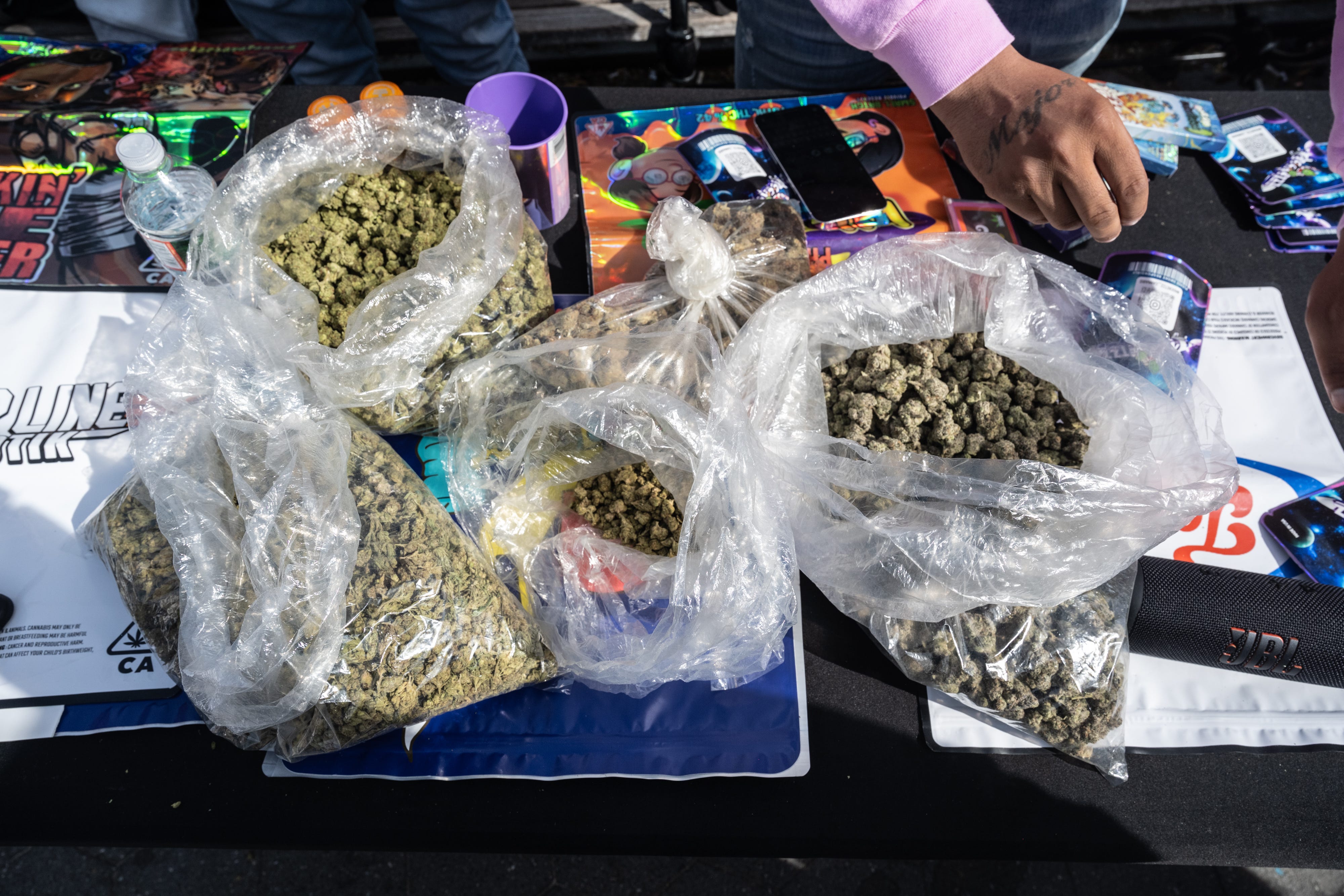 A dealer sells marijuana in Washington Square Park on April 20, 2025 in New York City.