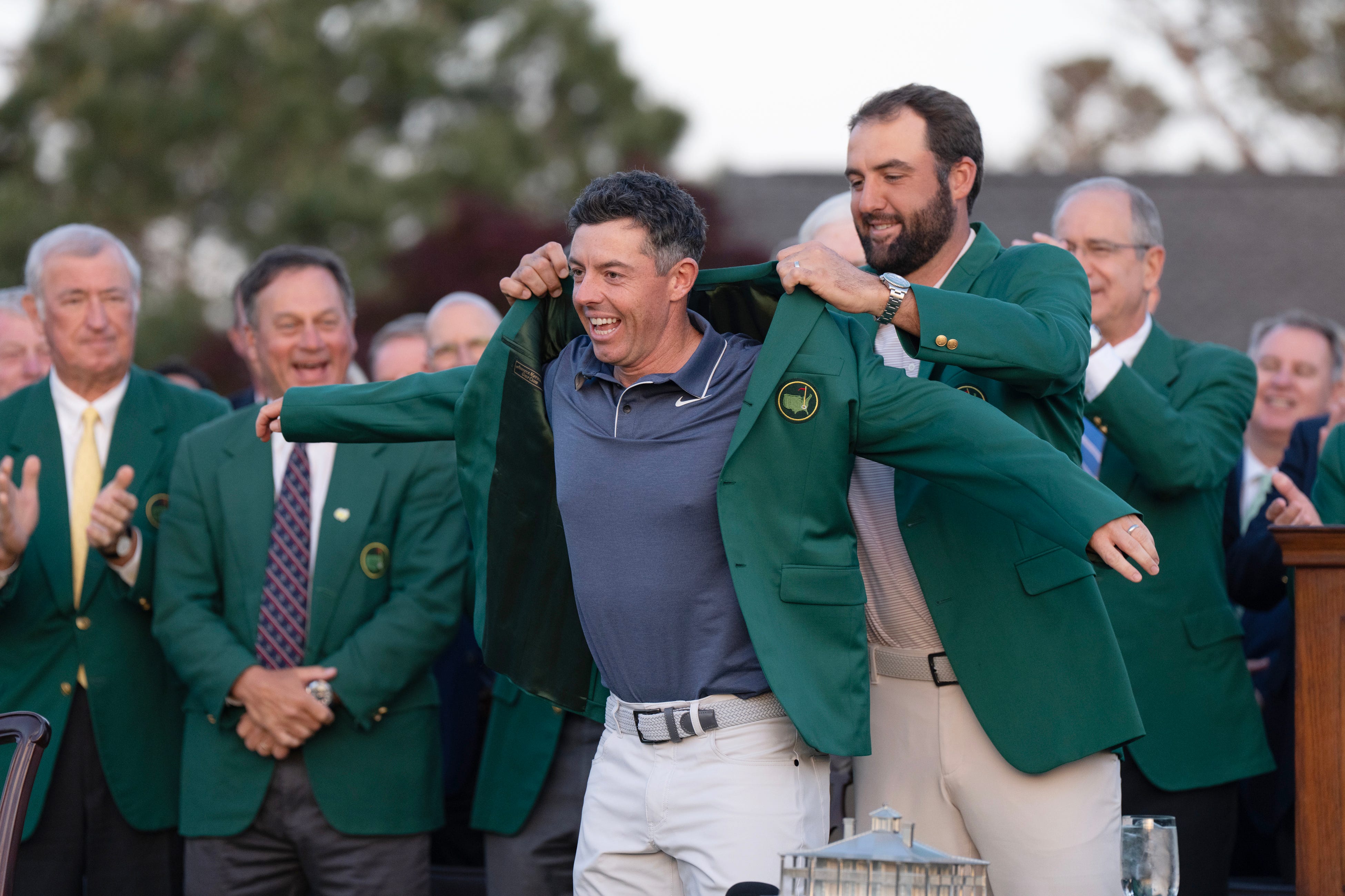 Rory McIlroy receives the green jacket for winning the Masters