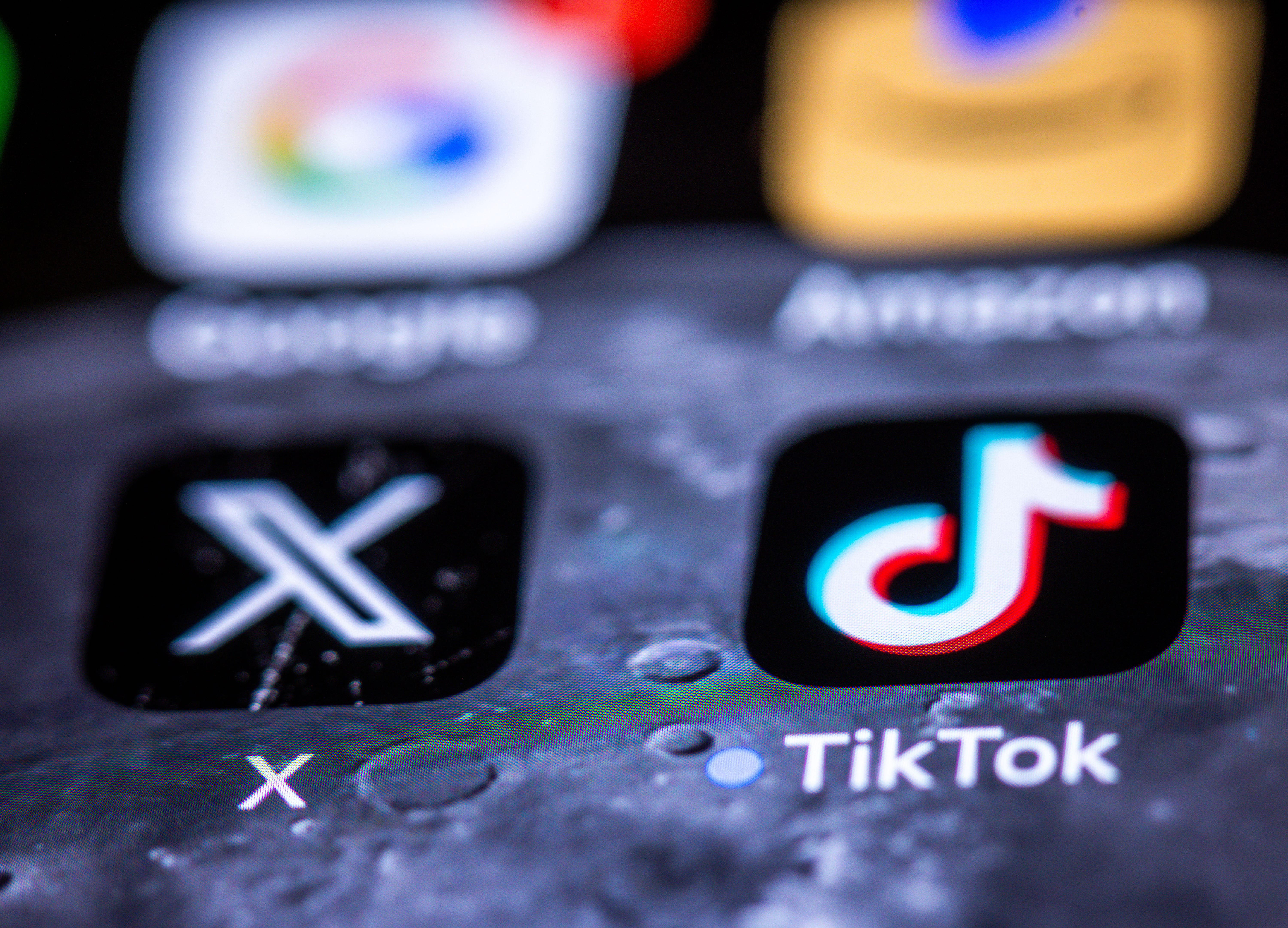The X and TikTok apps on a smartphone screen on April 10, 2025