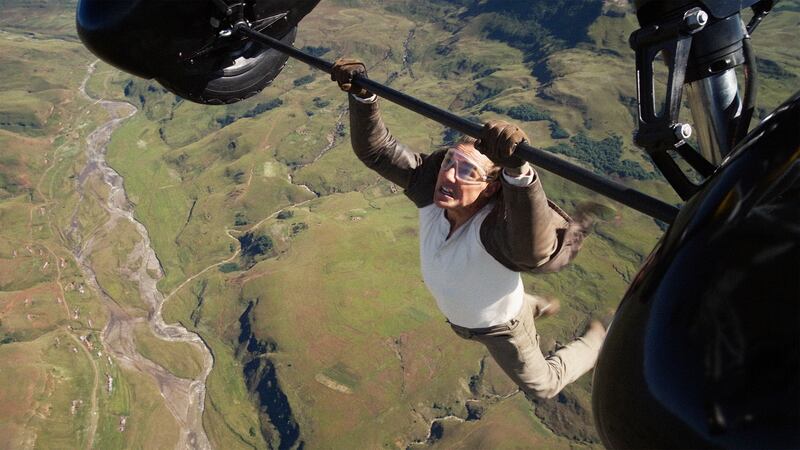 Tom Cruise hanging off a plane in Mission: Impossible - The Final Reckoning.