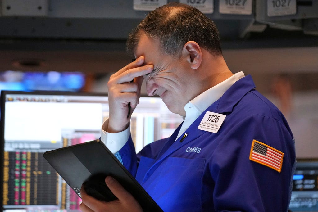 A stressed trader at the New York Stock Exchange.