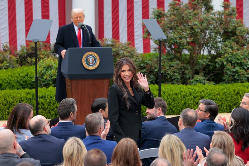 Kristi Noem and Donald Trump.
