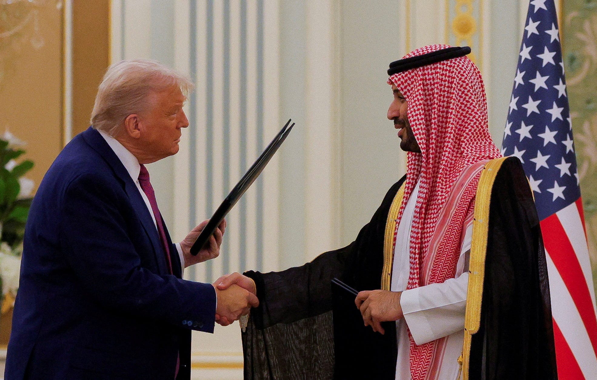 image of Trump and crown prince shaking hands