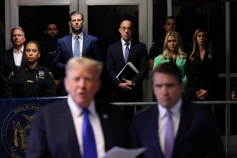Eric Trump, attorney Emil Bove, Trump 2024 National Press Secretary Karoline Leavitt, and attorney Alina Habba listen to former U.S. President Donald Trump speak as he arrives for his hush money trial at Manhattan Criminal Court on May 30, 2024 in New York City.