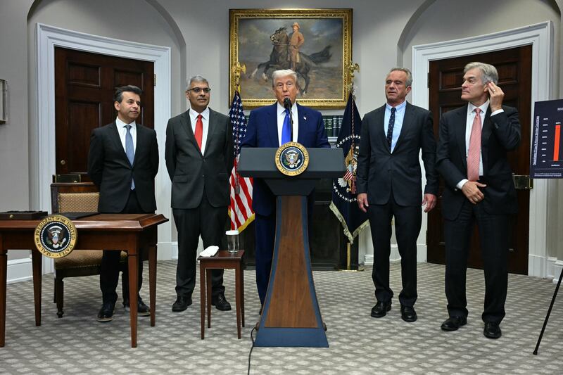 President Donald Trump (C), alongside (L-R) FDA Commissioner Marty Makary, National Institute of Health (NIH) Director Jayanta Bhattacharya, Secretary of Health and Human Services Robert F. Kennedy Jr and Administrator for the Centers for Medicare and Medicaid Services Mehmet Oz, speaks during a news conference about prescription drug prices, in the Roosevelt Room of the White House on May 12, 2025, in Washington, DC.